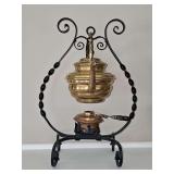 Antique brass wood handled tea kettle and warmer on a wrought iron stand. Very unique. 7x10.5x15 in tall.