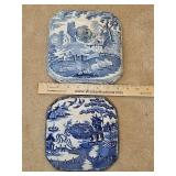 Two porcelain domed lids for decorative wall hangings.