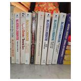 Grouping of 10 Agatha Christie paperback books. See all photos for titles.
