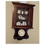 Corner shelf and dark cherry wood finish. Front diameter is 18.5 in, height is 31 in tall. Contents NOT included.