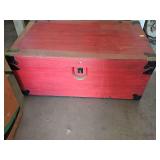 Wood trunk painted red. Dusty from attic storage. 29.5x 17x 12.5 in tall.