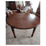 Antique table on casters. 44 x 28.5 in tall.