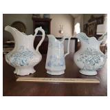 Three blue transferware pitchers.