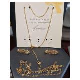 Gold filled items. Two baby lapel pins, baby ring chain, and 16 in chain. 2.56 grams