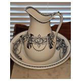Wash bowl and pitcher made in 1896 by W. Adams. Has repairs.
