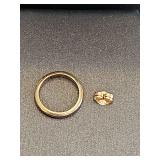 14K yellow gold baby ring and earring back. 1.14 grams