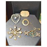 Grouping of unmarked brooches. See all photos.