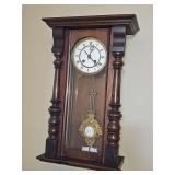 19th-century German regulator wall clock with "mask" pendulum. 13x6.5 x 21.5 in tall. Trim piece missing from bottom right side but is available for reattachment. Was not keeping time when listed.