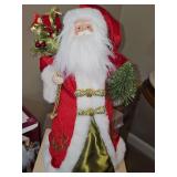 Santa in red velvet hat and coat. 19 in tall.