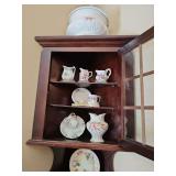 Contents of corner curio cabinet. See all photos.