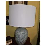 Blue/gray speckled lamp with matching finial and linen drum shade  24.5 in tall.