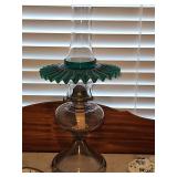 Pressed glass oil lamp with green petticoat ruffled shade. 19.5 in tall.