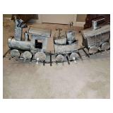 Tin train on tracks. 29x7.5 x 12 in tall.