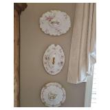 Three porcelain vintage/antique lids used as decorative wall hangings. Nine, 10, and 11 in diameter.