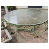 Round patio table with glass top and iron base. Originally base for lot 230 (not included) 41x18 in tall.
