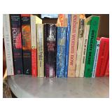 Grouping of various titles and genres paperback books. See all photos.