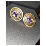 14K earring post marking with purple stone
