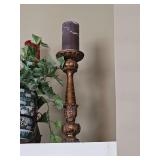 Two candlesticks. Approximately 20 in tall. Does not include planter. Top shelf left of fireplace.