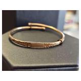 Vintage baby bracelet. Gold tone. Unmarked. Non-reactive to magnet. 6.37 grams. Same style as baby lapel pins in lot 172. (Not included.)