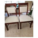 Two Ashley Furniture sturdy chairs. Upholstery is not damaged. It