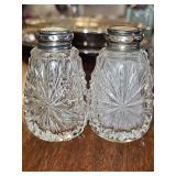 Antique cut glass salt and pepper shakers with sterling lids and mother of pearl inserts. See all photos. 3.25 in tall.