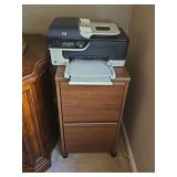 HP Officejet J4550 all-in-one printer and two drawer file cabinet. File cabinet contents not included.