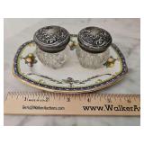 Antique Bishop and Stinier small plate and two cut glass dresser bottles with silver plate tops. One jar has damage.