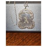 Sterling silver 20-in chain with a sterling silver 1.5 in pendant with initial A.