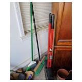 Shop broom, house from, and broom with dustpan attached.