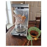 Chemex pour-over coffee carafe with a wooden collar and leather tie. Untested.