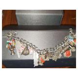 Sterling silver charm bracelet with sterling charms. 48.61 grams