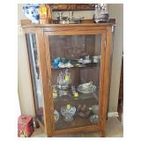 Lighted oak "triangular" curio cabinet. 44x17x57 in tall. Contents NOT included.
