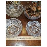 Four cut glass bowls. Chips on each as shown.