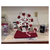 Collection of Mississippi State Memorabilia and tailgating supplies - serving pieces, insulated cups, table linen, custom decorative towels, playing cards, trivet