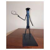 Whimsical handcrafted tennis player made from railroad spike and other metals - mounted on a steel plate…..9” tall