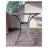 Black metal pub height patio table…..42”D x 42” tall…..has a center hole for umbrella (not included)