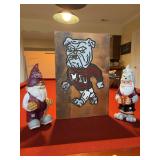 Grouping of Mississippi State Memorabilia - 2 resin gnomes (11” tall) and a handcrafted wood wall art piece (11 x 17)
