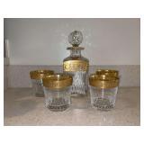 Saint-Louis crystal decanter and (4) matching old-fashioned tumblers from the "Thistle Gold" collection