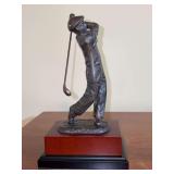 Decorative bronze golfer statue, often used as a golf trophy or collectible figurine on wood base…..9–/1” tall