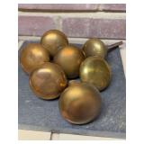 Grouping of (7) various diameter vintage brass doorknobs