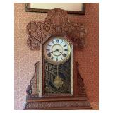 Ingraham carved wood mantel clock (no key)…..14-3/4 x 4-3/4 x 22 tall…..could not find exact match but research indicates a close match