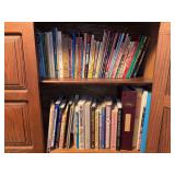 Contents of bottom right cabinet of bookshelf