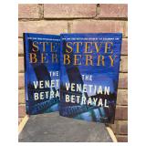 (2) signed first edition hardback copies of “The Venetian Betrayal” by Steve Berry…..both have dust jackets and both have yellowing on top edge…..comes with promo photo