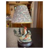 Very cute small tabletop lamp with porcelain hen & rooster and leaf design shade…..13-1/2” tall and working condition