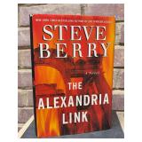 Signed first edition hardback copies of “The Alexandria Link” by Steve Berry…..includes dust jacket…..top corner of dust jacket by spine is slightly damaged