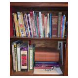 Contents of bottom left cabinet of bookshelf