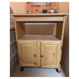 Light color wood rolling utility cart…..can be used for microwave or other uses…..26-3/4 x 17 x 35 tall…..CONTENTS NOT INCLUDED….shows wear from normal use