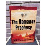 Signed first edition hardback copy of “The Romanov Prophecy” by Steve Berry…..includes dust jacket and promo photo