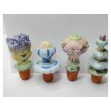 Vintage whimsical set of 4 porcelain bottle stoppers, the stoppers have degraded, for decoration or other uses.