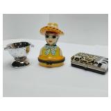 Porcelain hinged trinket boxes, colander, hat/sunglasses lady, sunglasses case. Colander and lady are empty.